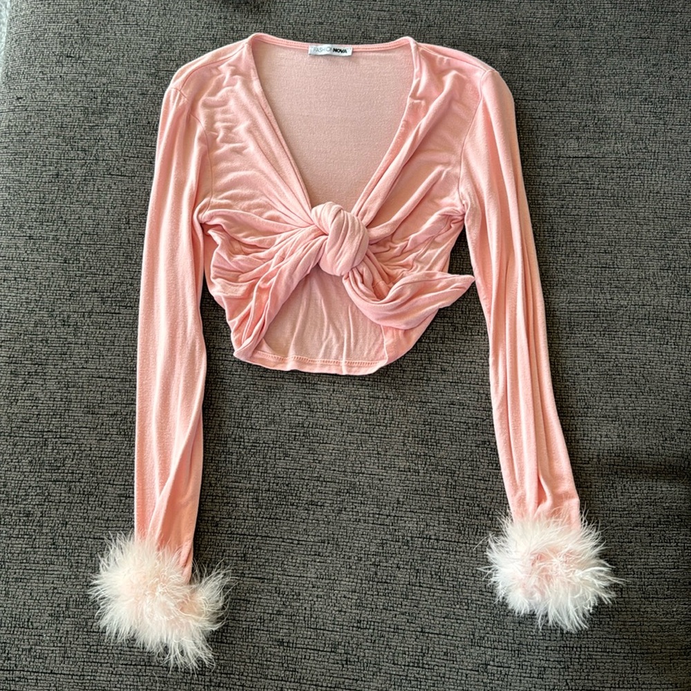 Pink crop top with feathery tipped sleeves